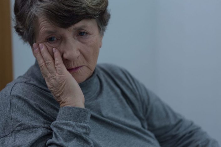 Portrait of older woman suffering for depression