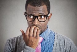 Anxious young business man looking away