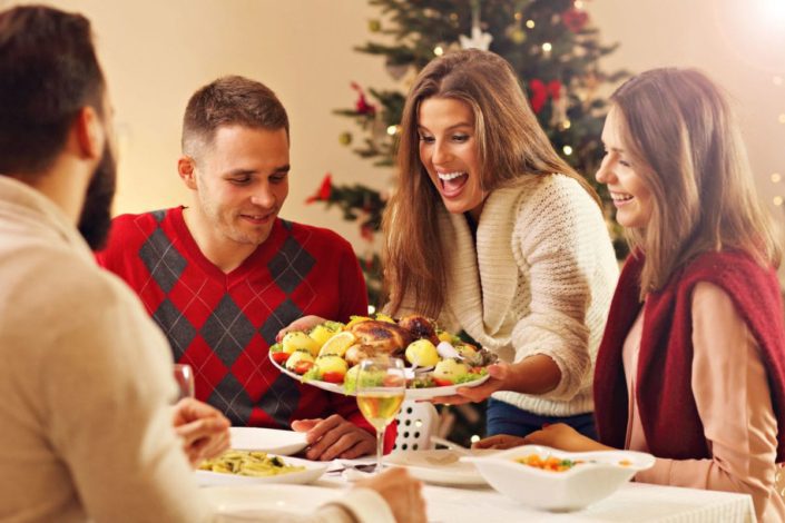 friends getting ready to eat Christmas dinner