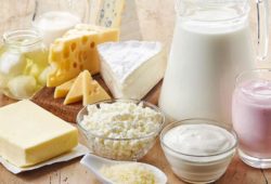 A collection of calcium-rich foods including cheese, milk and yogurt.