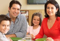 family eating dinner and watching their cholesterol