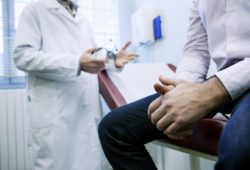A man sits on an exam table in a doctor’s office. Testicular torsion is an emergency that happens when a man’s testicles rotate and the spermatic cord becomes twisted. It can occur at any age.