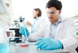 Male clinician testing vaccine in lab