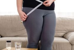 A woman measure her waist with measuring tape. Prescription weight loss medicines such as Ozempic can help you lose weight when diet and exercise alone are not working.